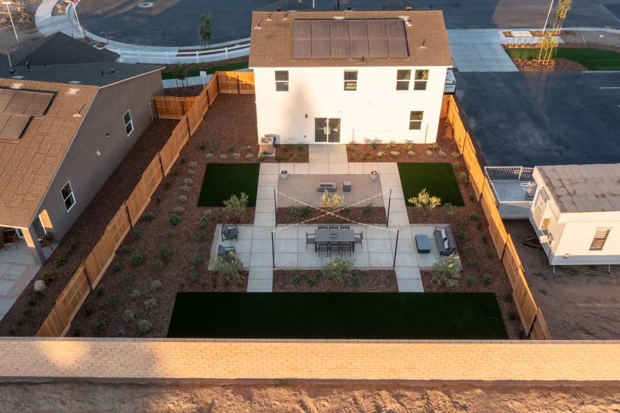 A building with a green lawn.