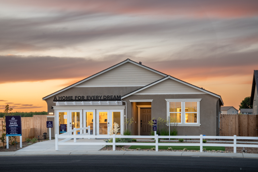 A building with a fence in front.