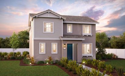 A house with a yard and a fence.