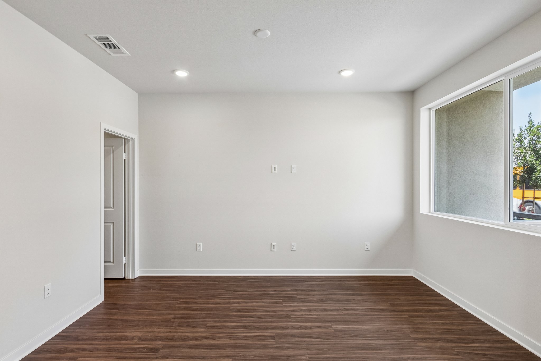 A room with a wood floor and a wood floor.