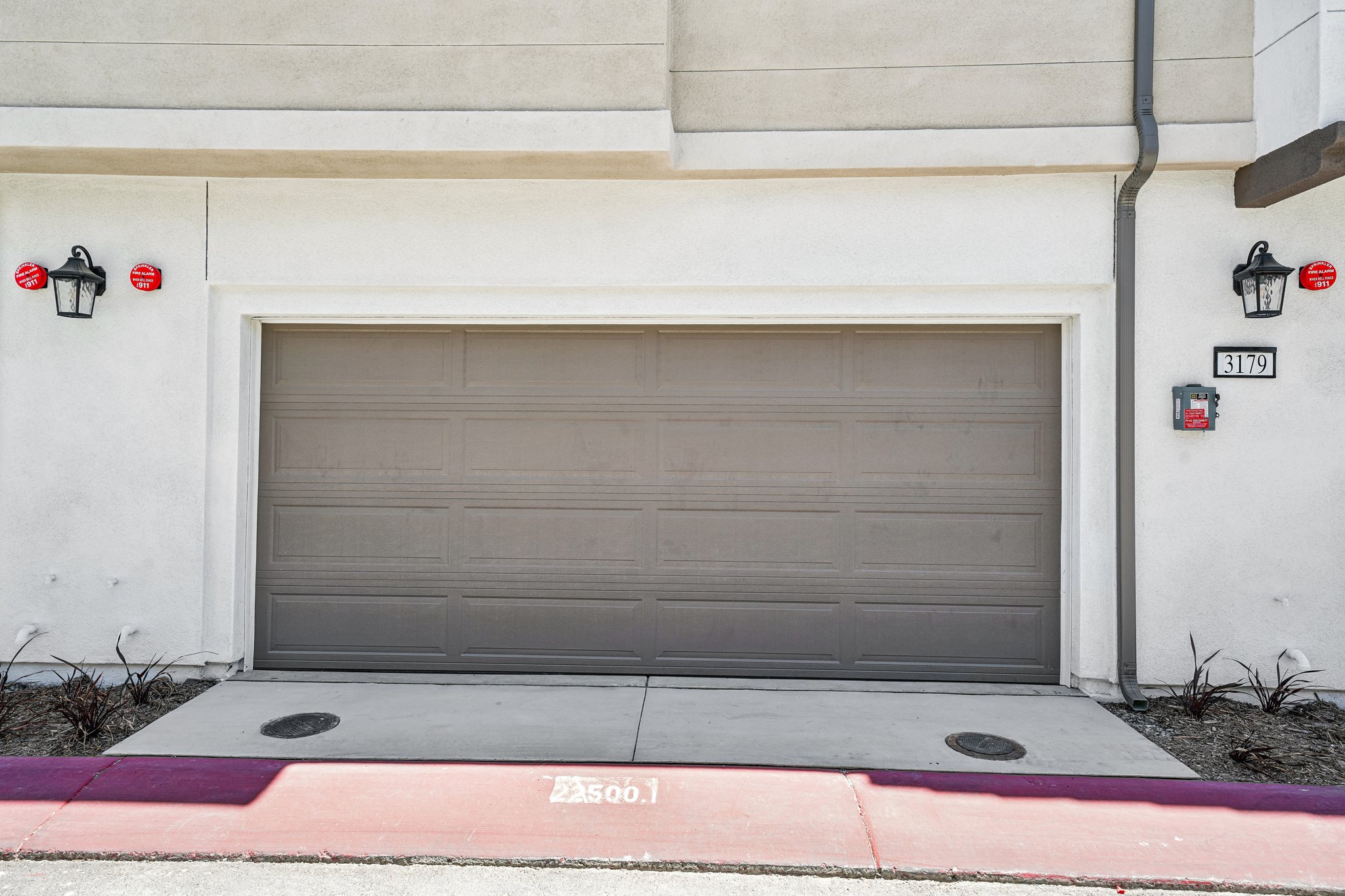 A garage door with a sign on the side.