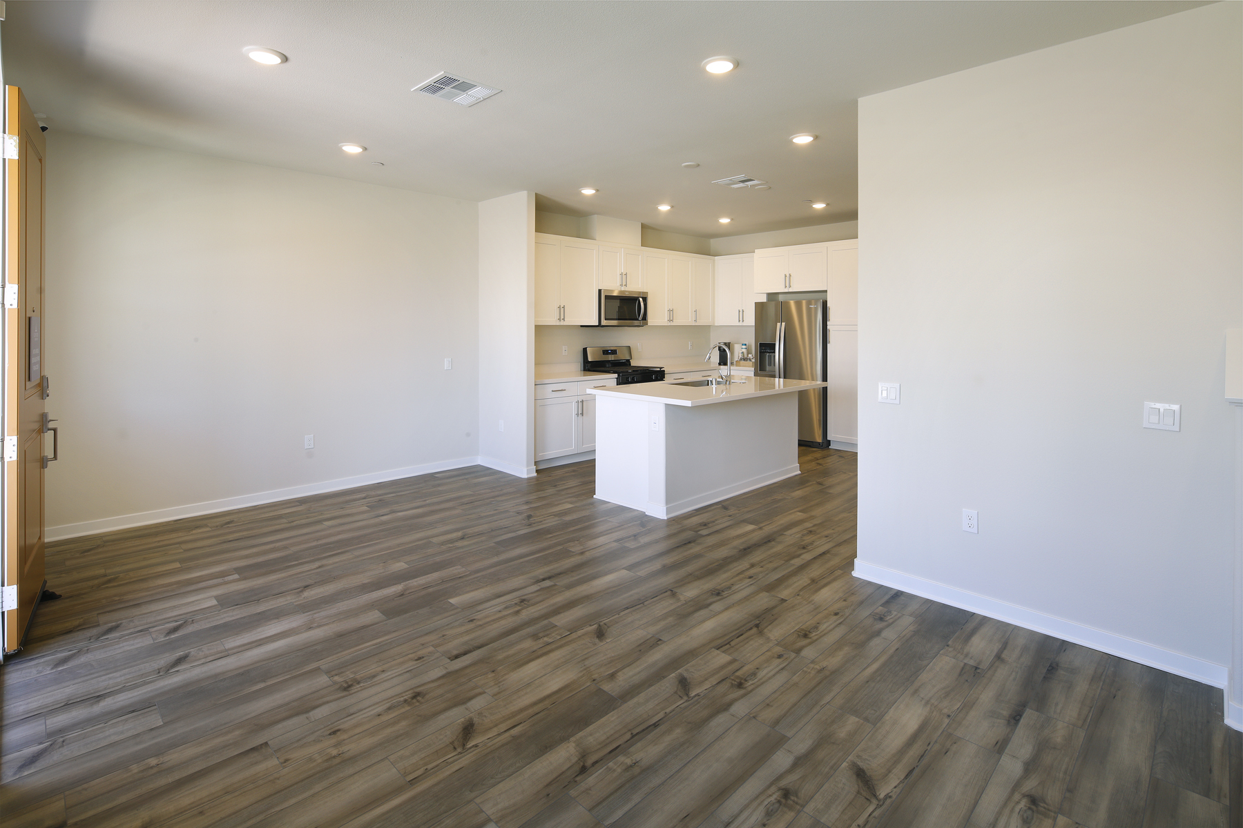 A kitchen with white walls.