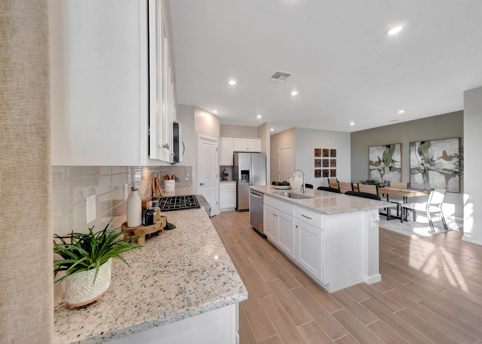 A kitchen with marble counters.