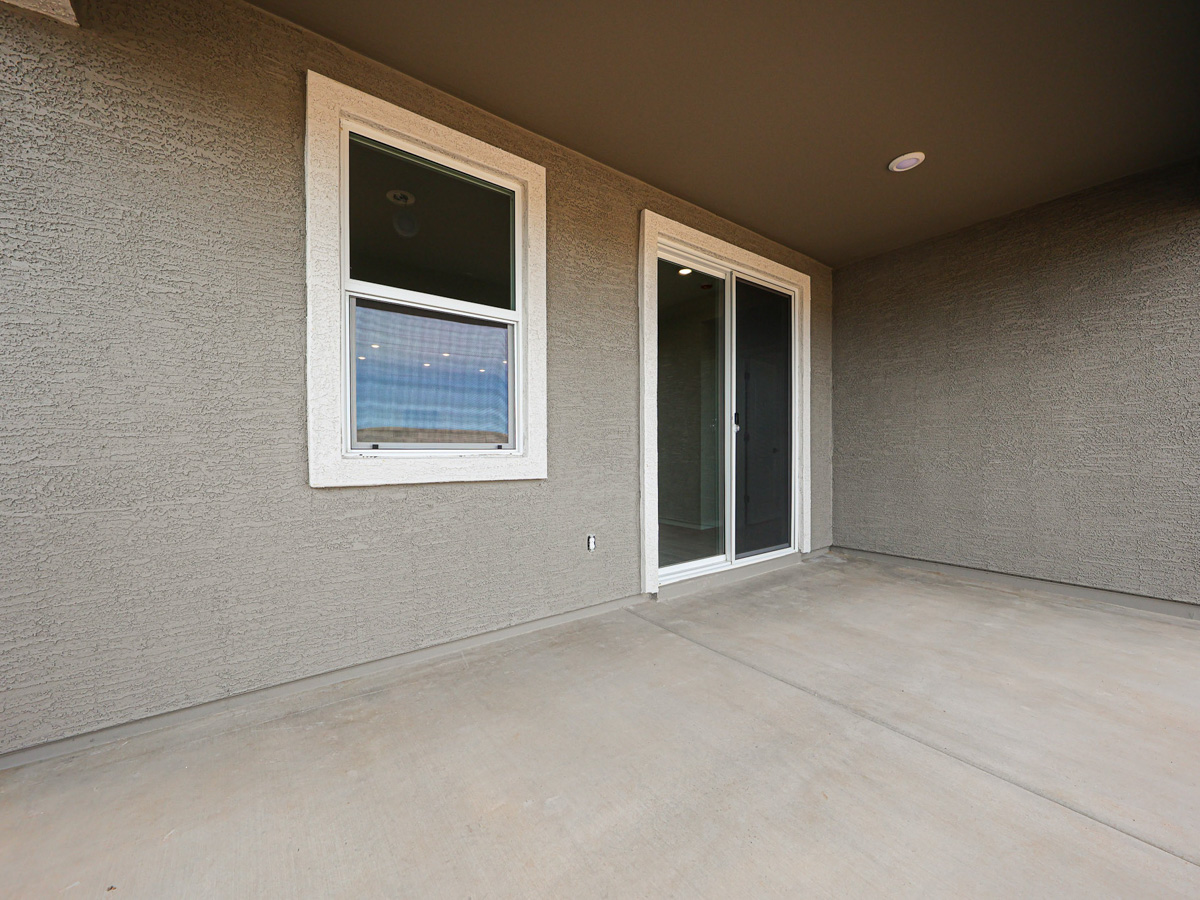 A room with a window and a door.