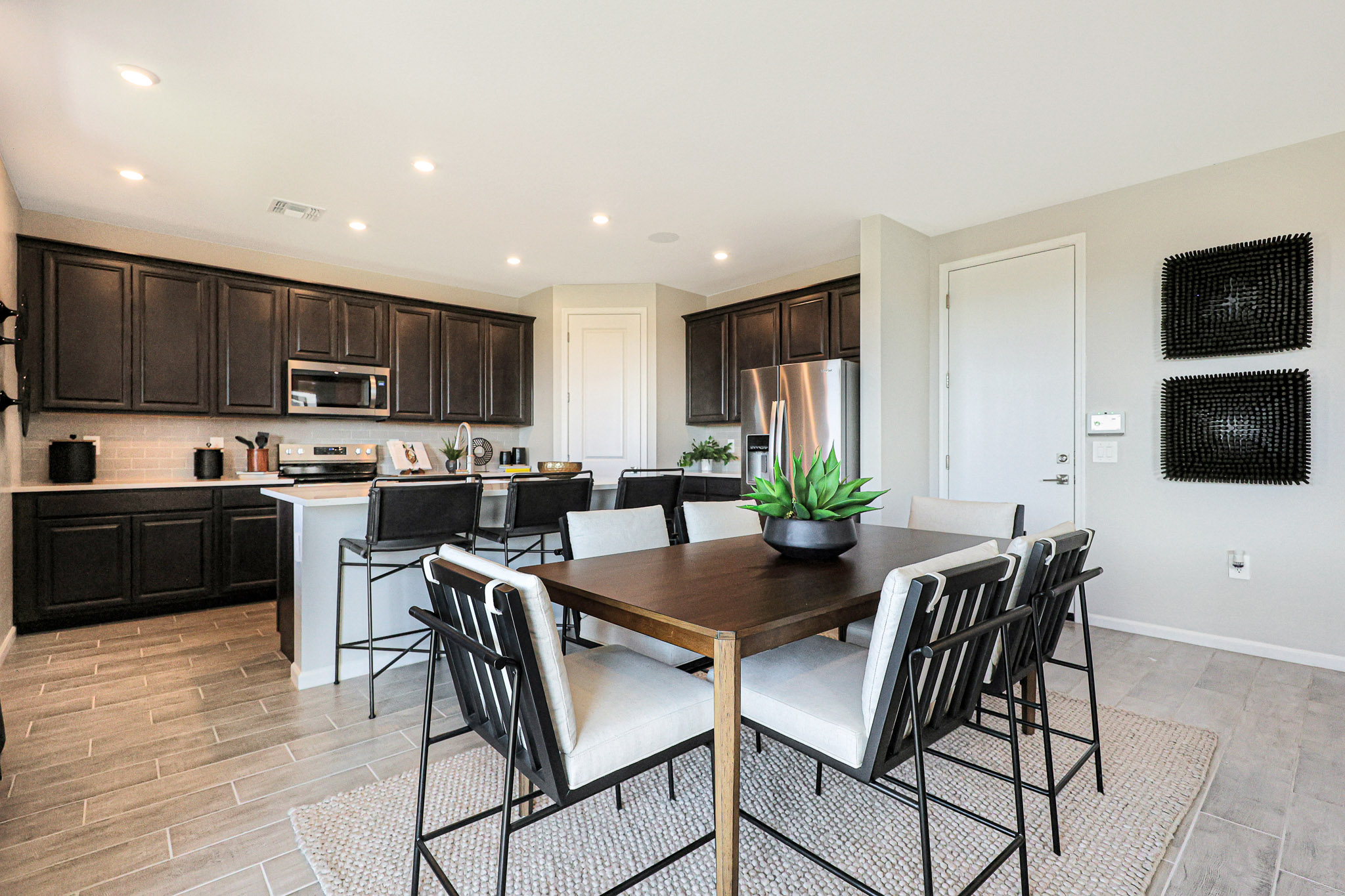 A kitchen with a dining table.