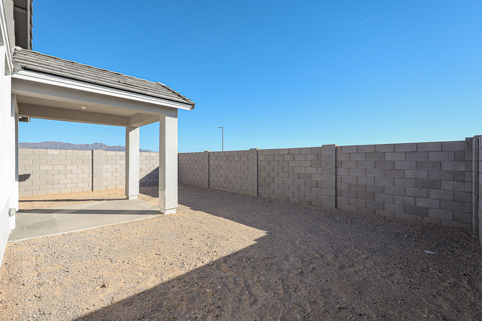 A stone wall with a stone walkway.