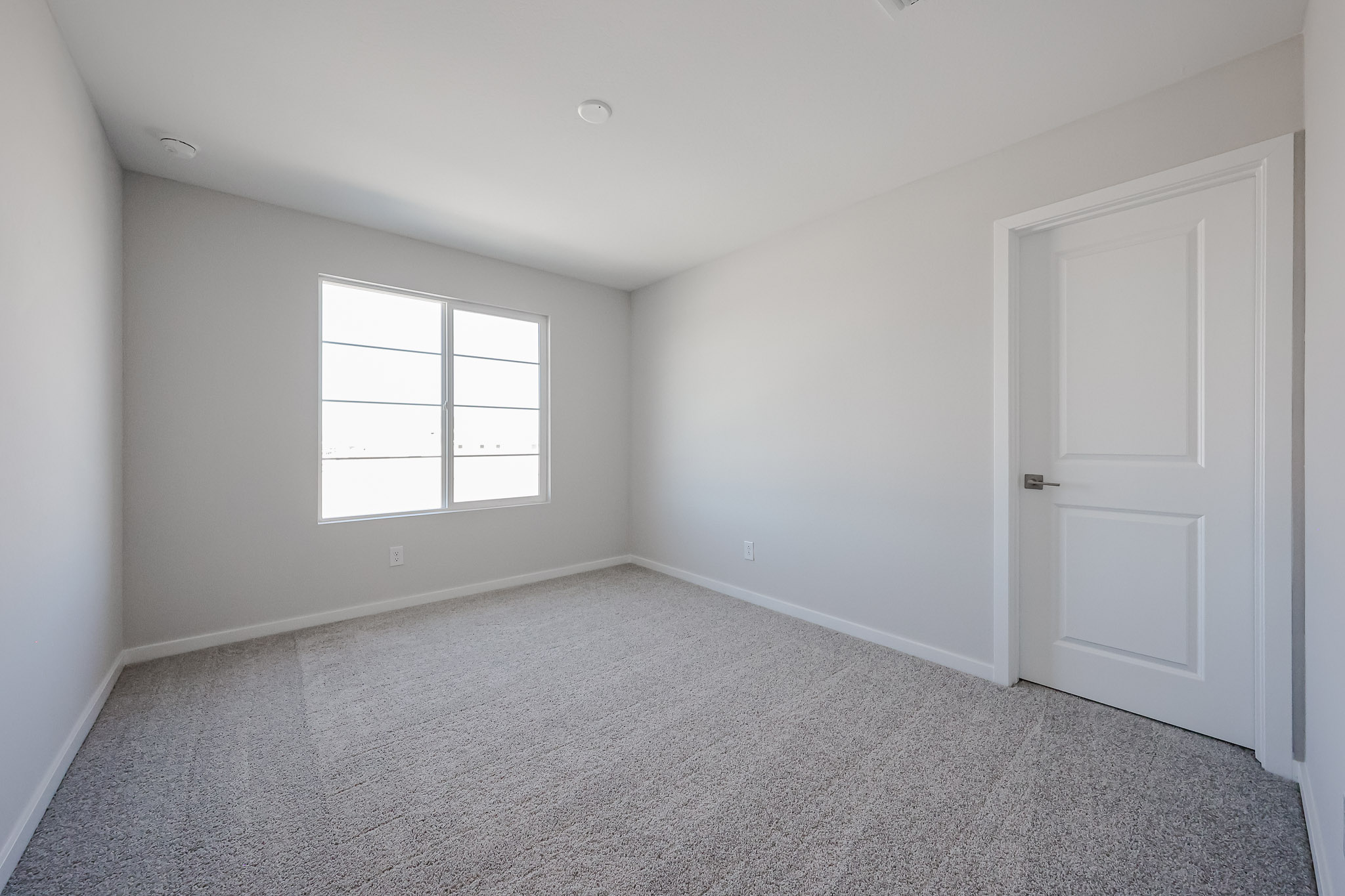 A room with a door and a window.