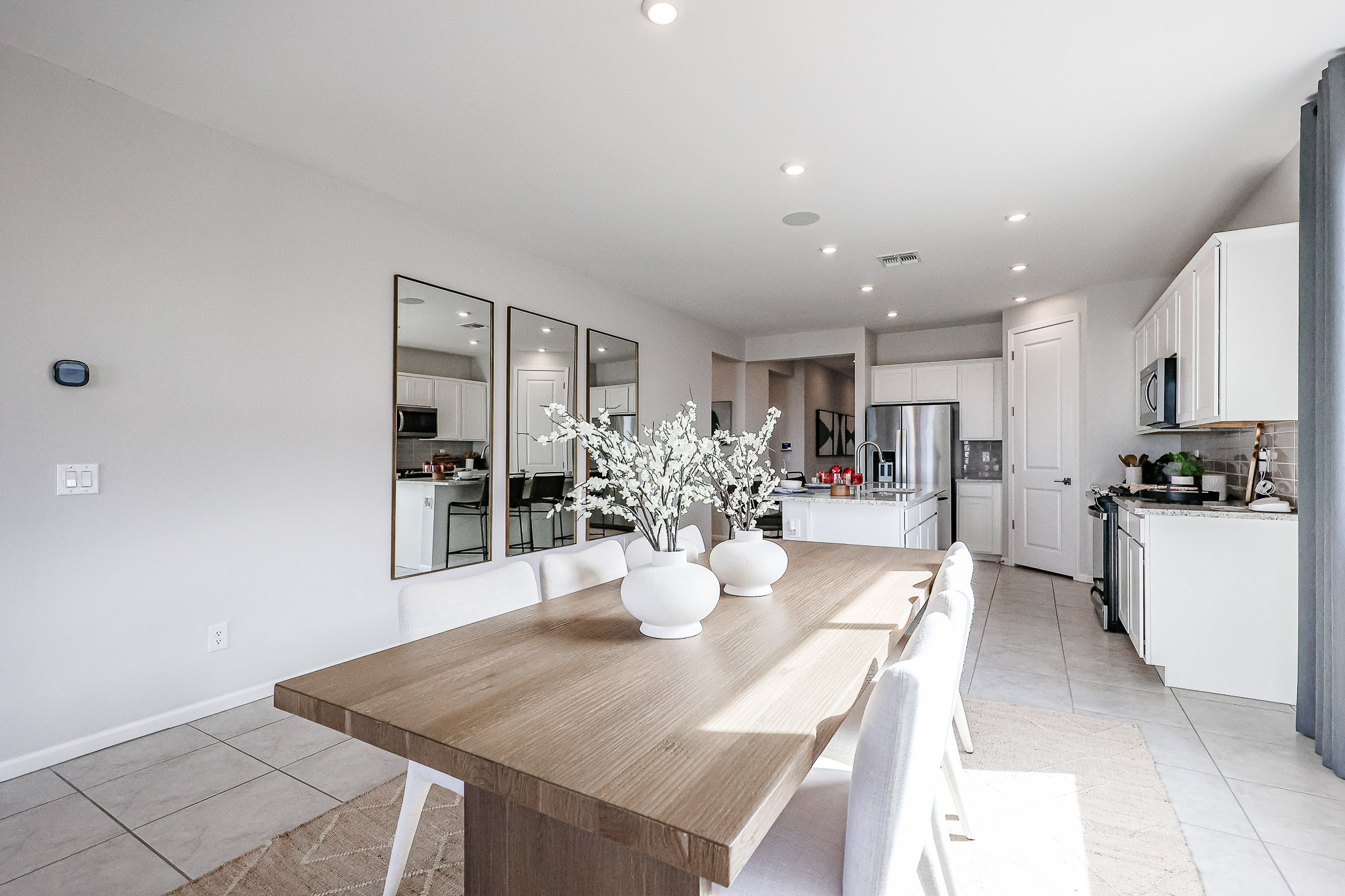 A kitchen with a dining table.