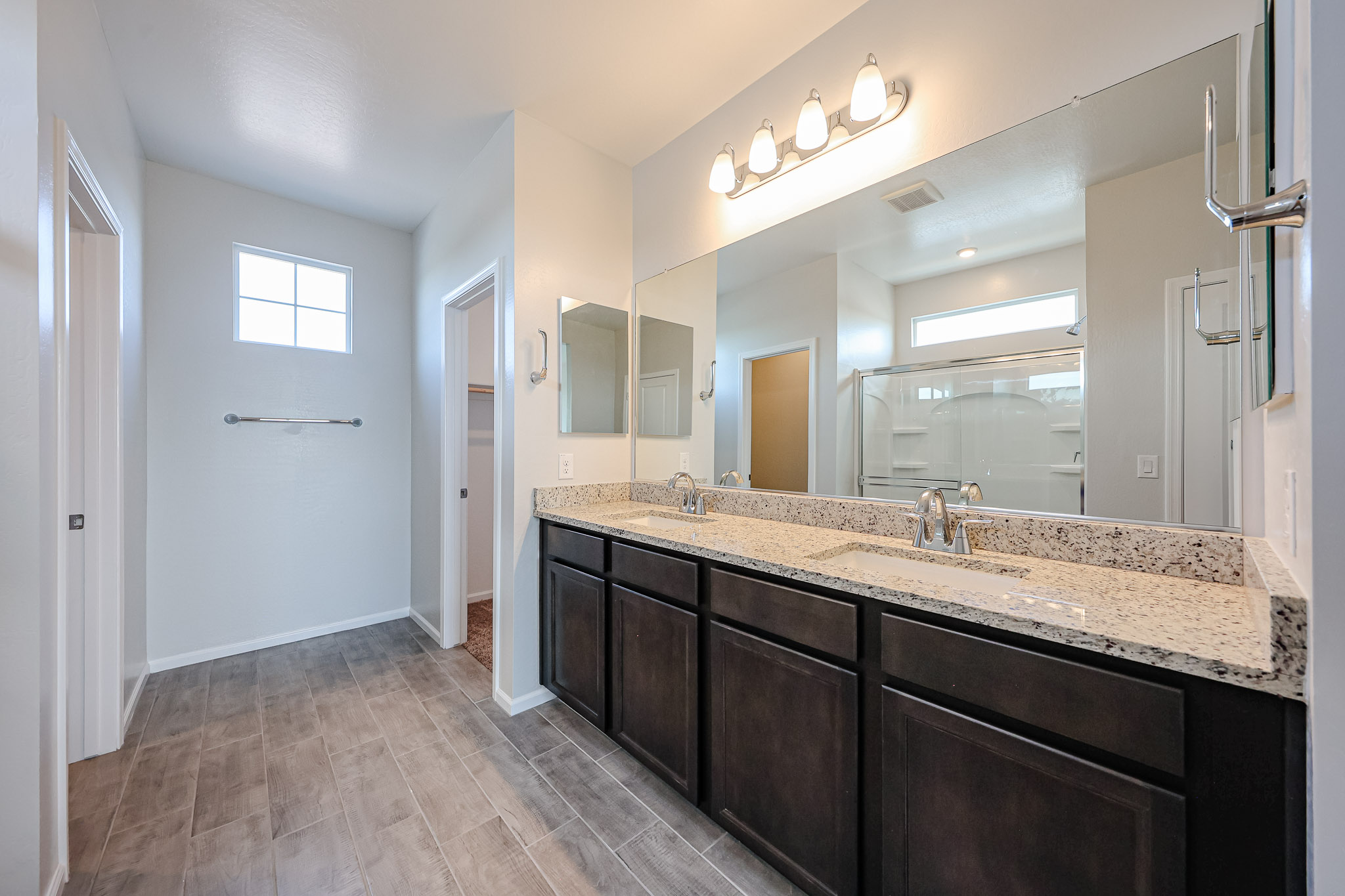 A bathroom with a marble countertop.