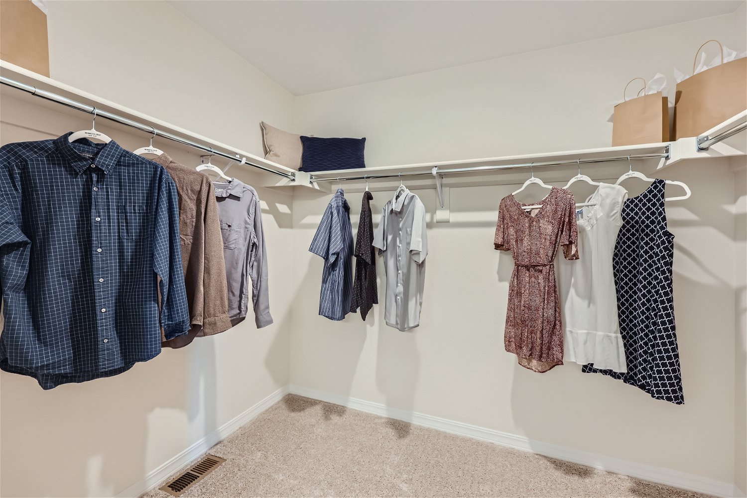 A group of clothes on a rack.