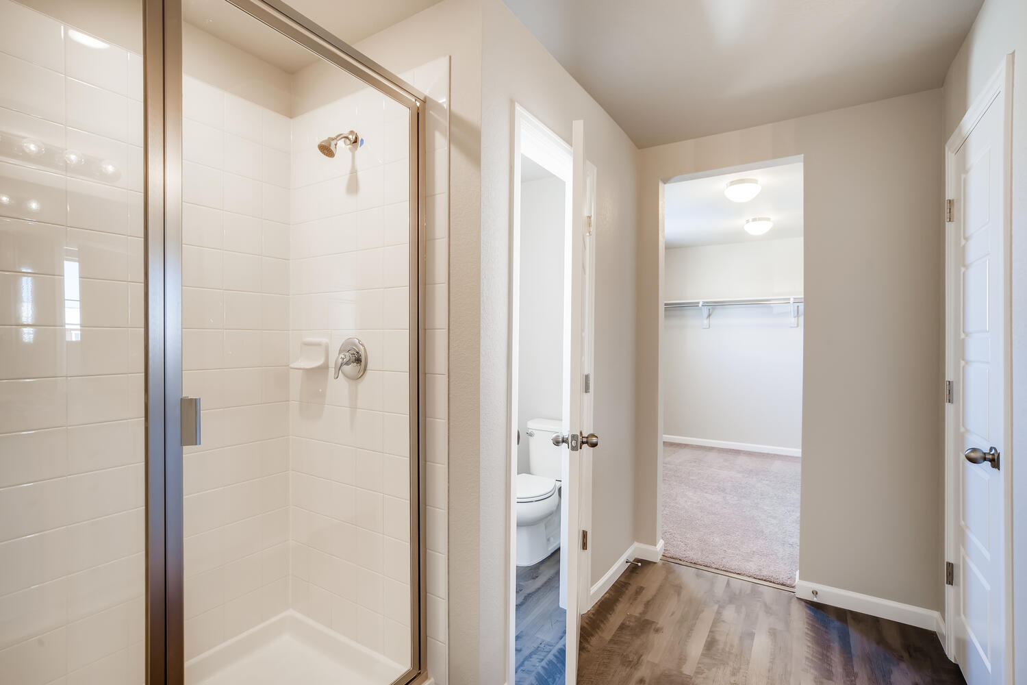 A bathroom with a shower unit.