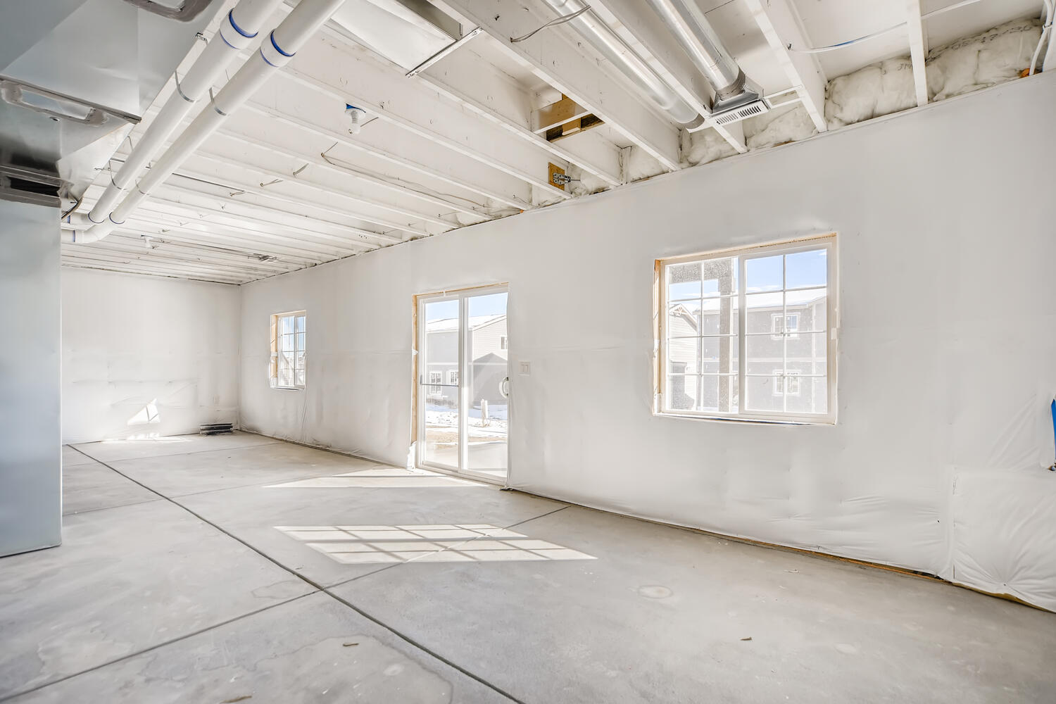 A room with a door and windows.
