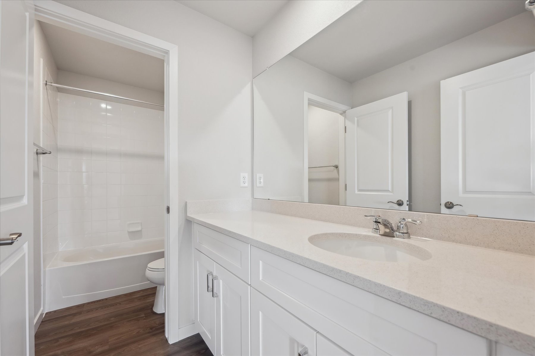 A bathroom with a sink and a toilet.