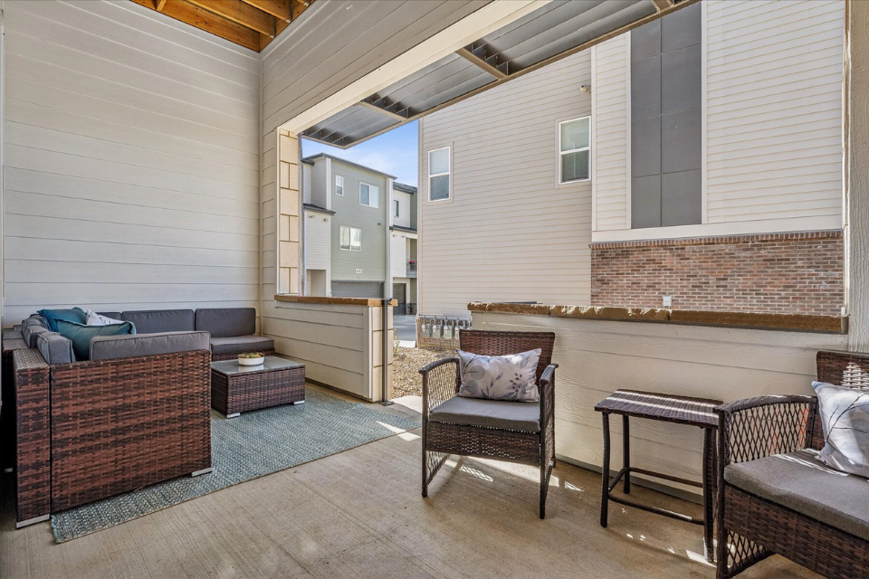 A living room with a couch and chairs.