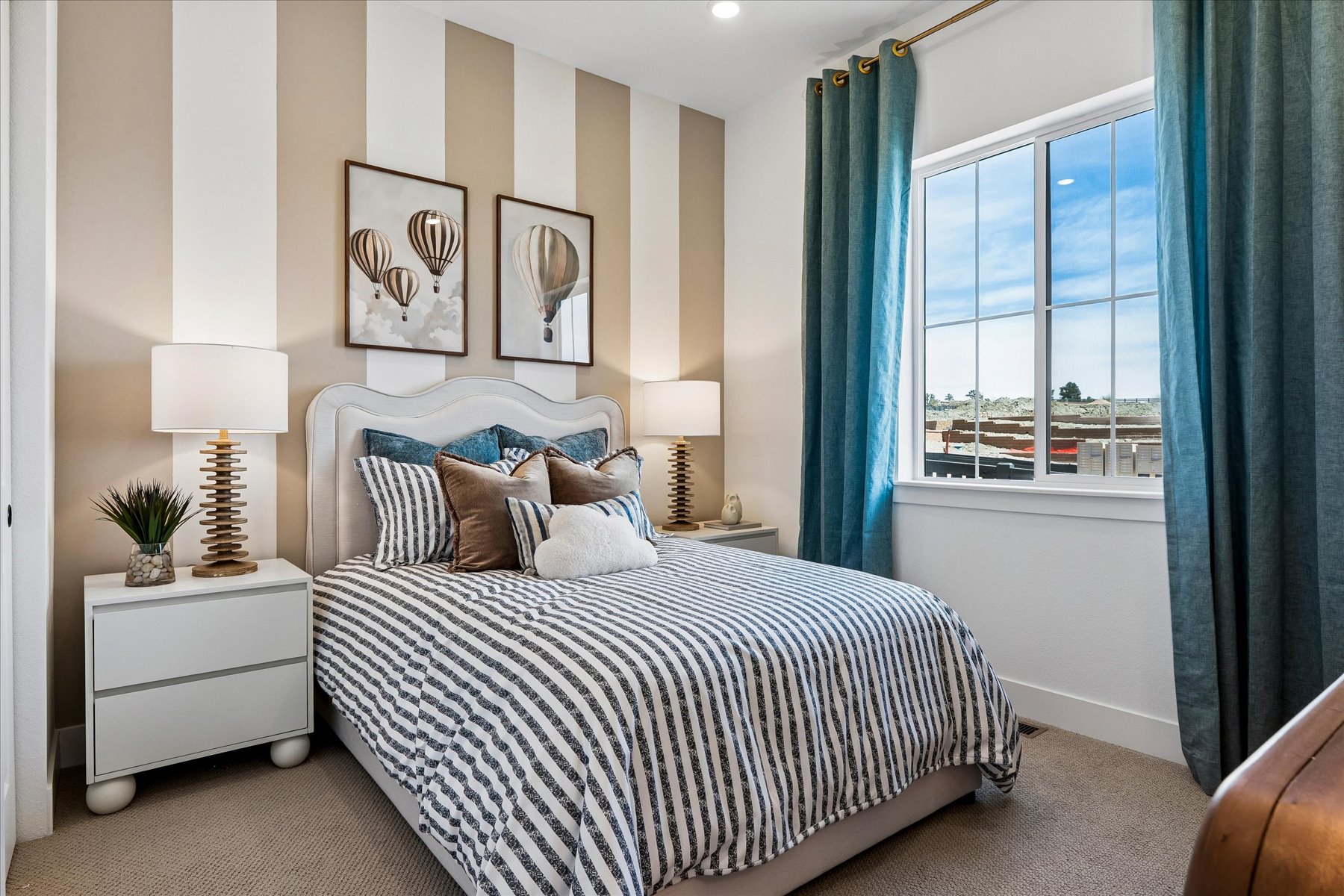 A bedroom with a bed and a window.