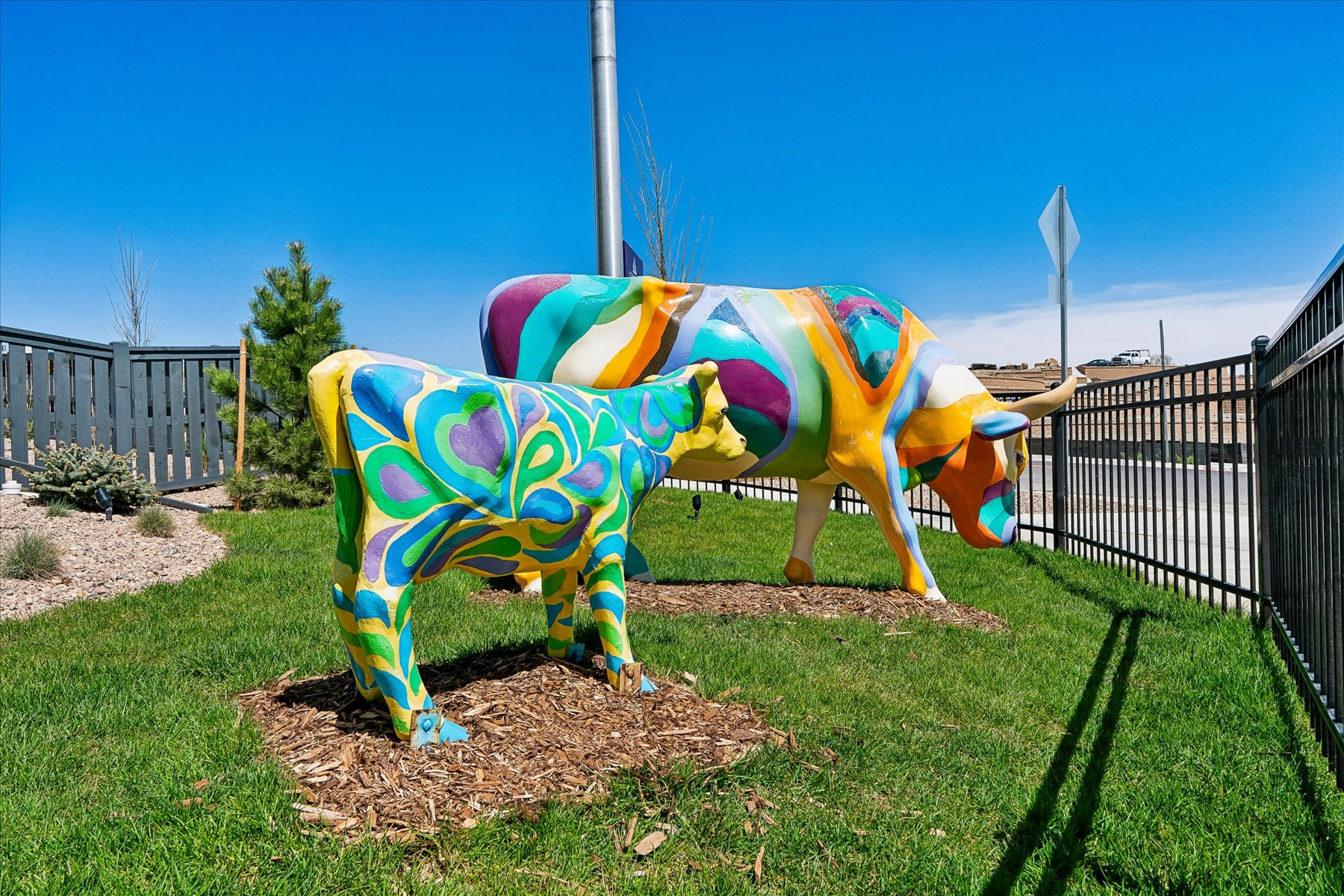 A colorful sculpture of a cow.