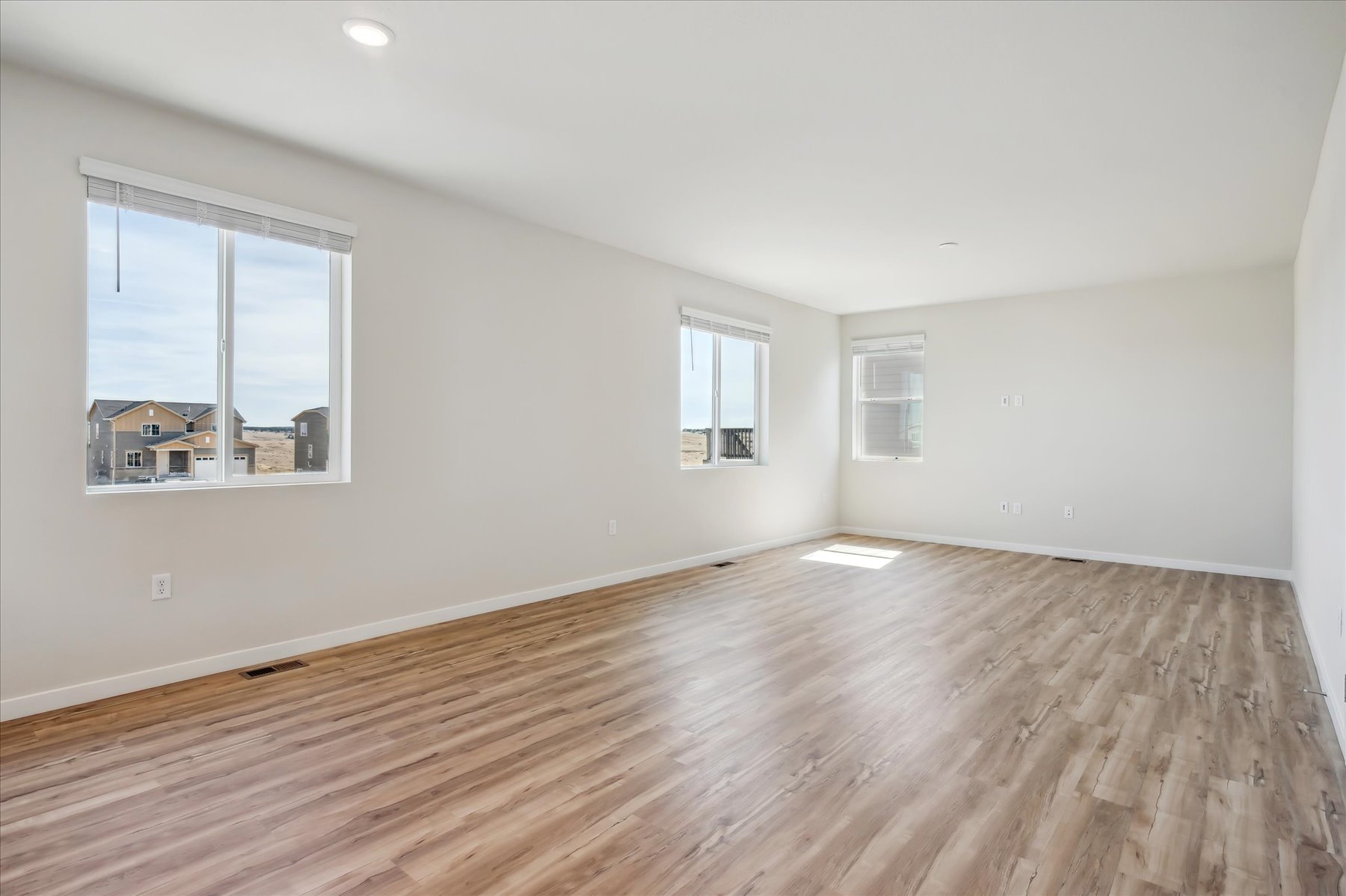 A room with a wood floor and a wood floor.