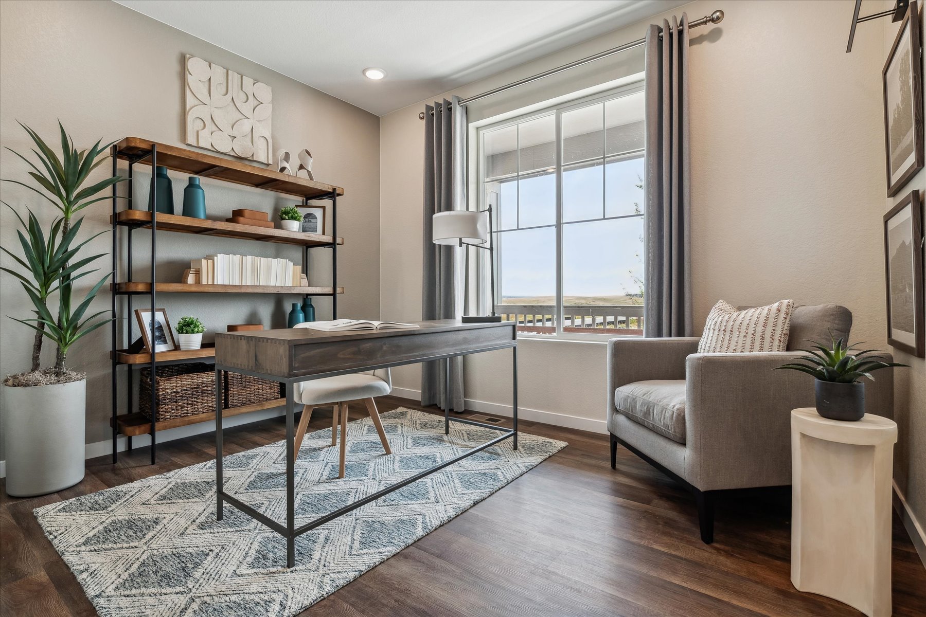 A living room with a table and chairs.