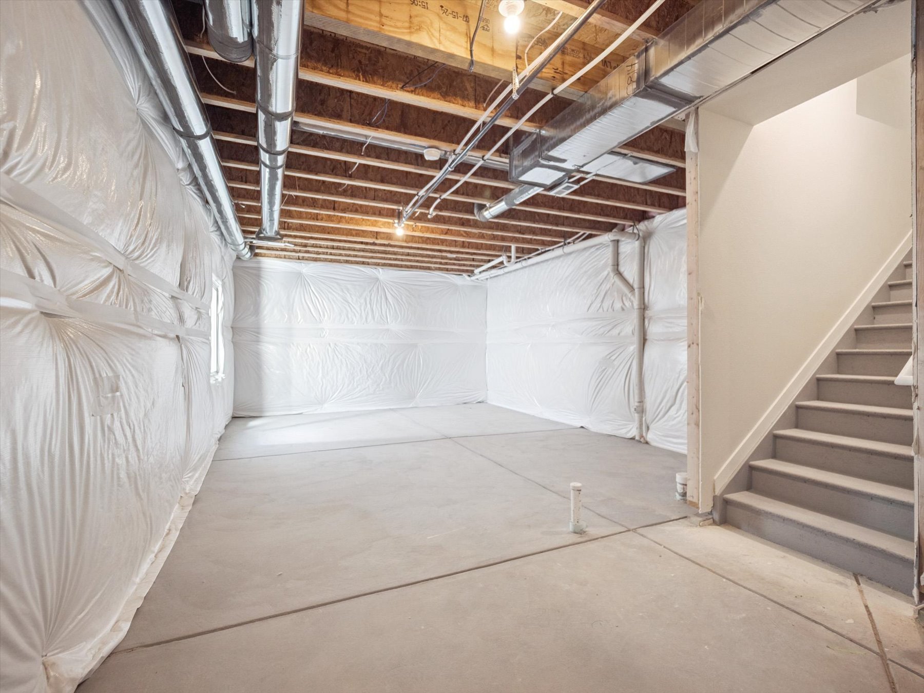 A hallway with white walls.