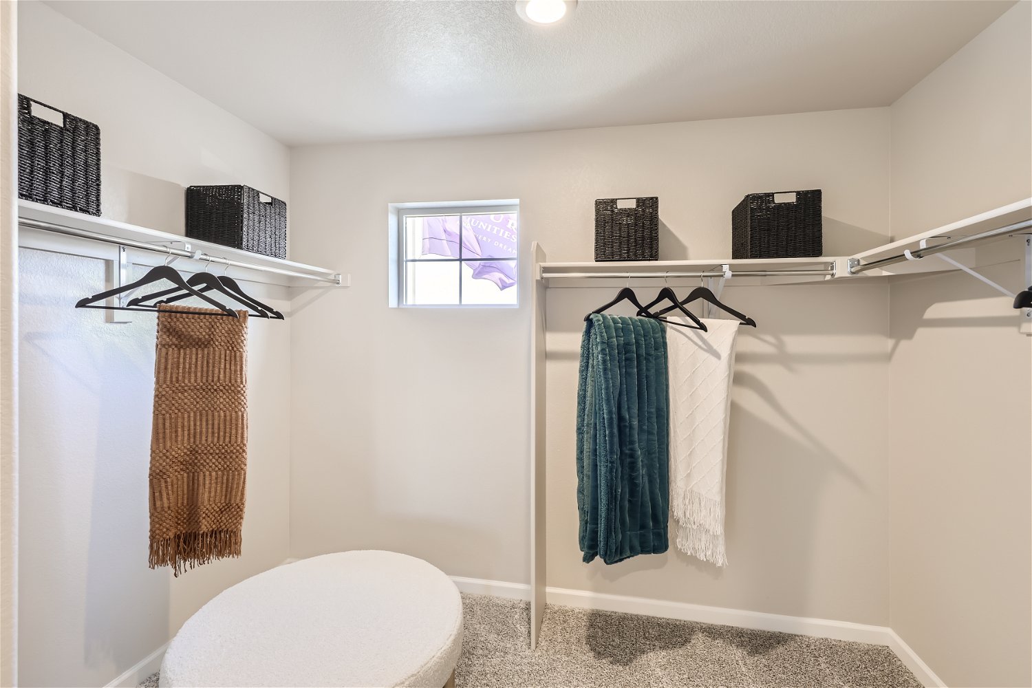 A bathroom with a toilet and towels.