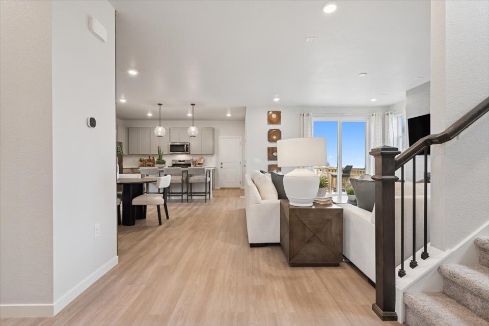 A living room with a wood floor.