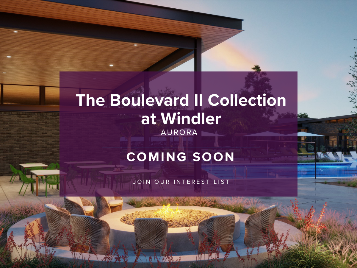 A large purple wall with a pool and chairs in front of it.