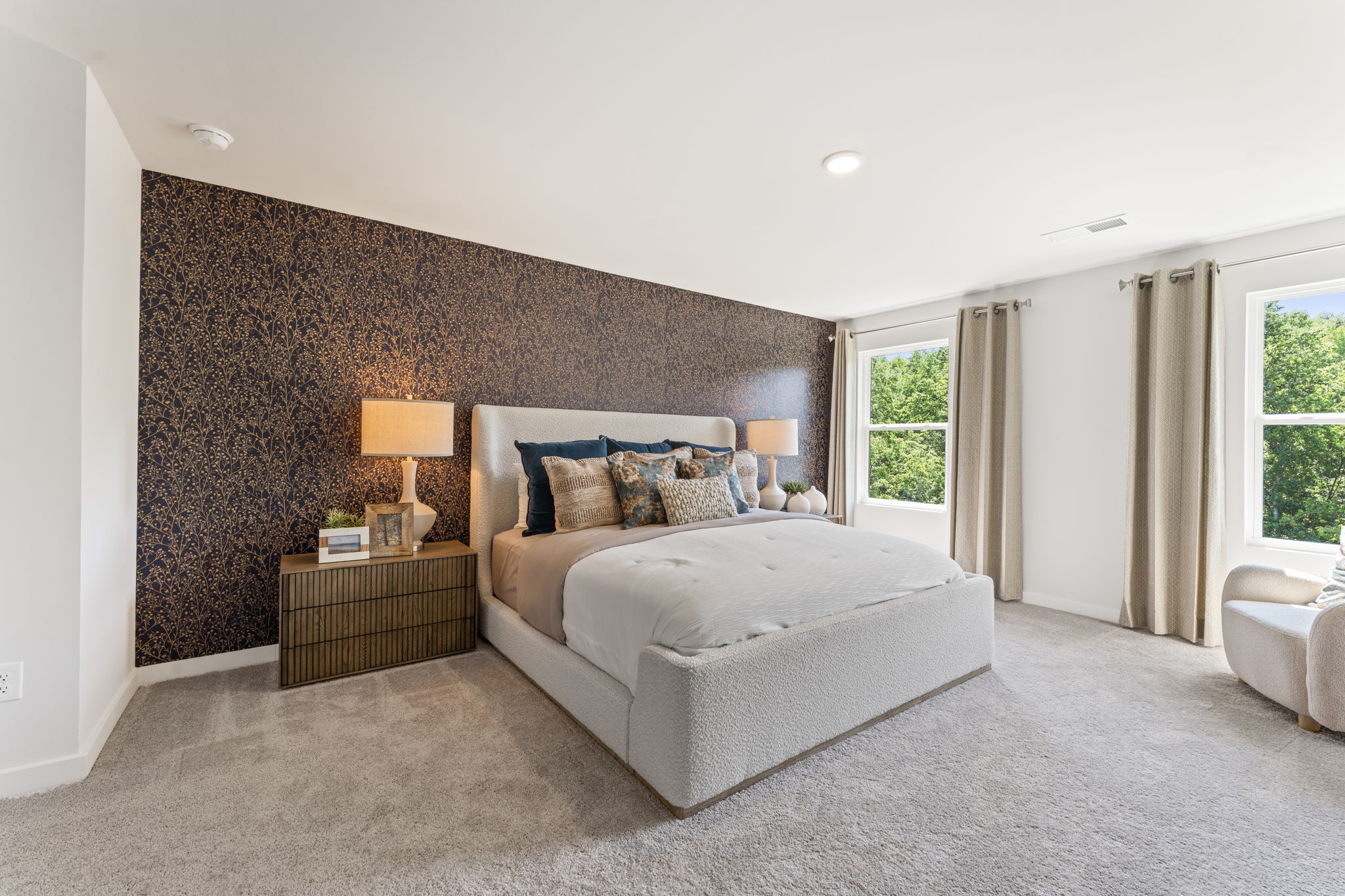 A bedroom with a bed and a couch.