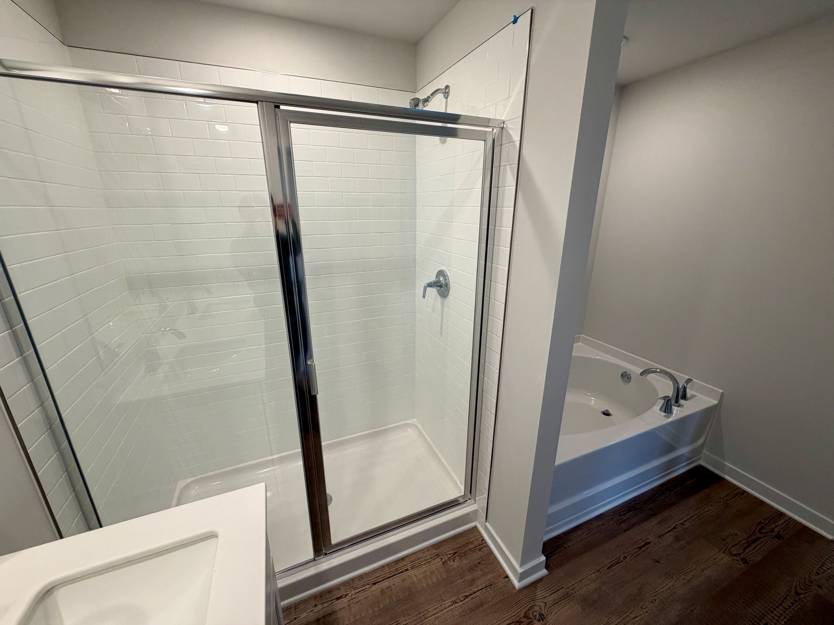 A bathroom with a glass shower.