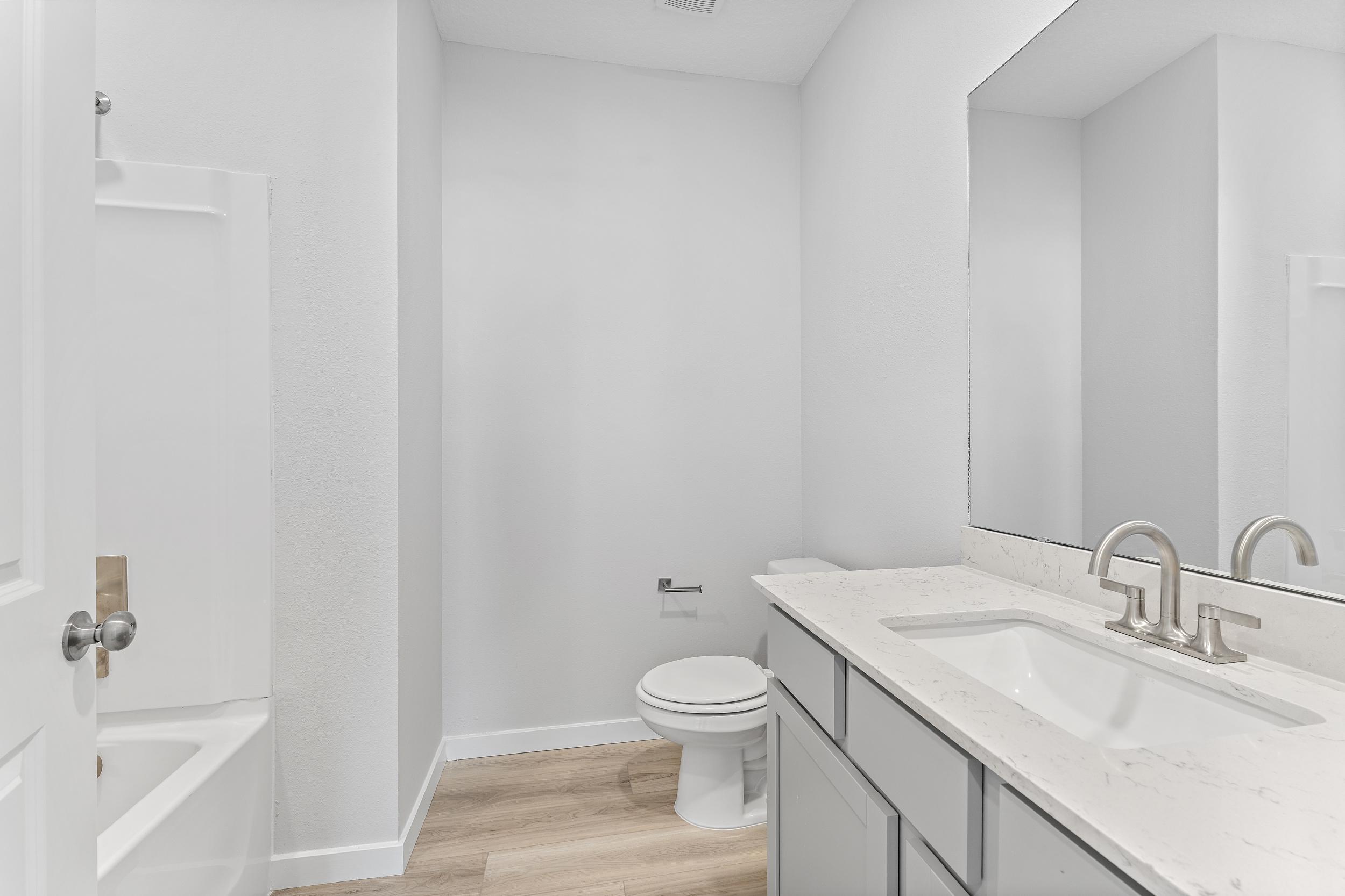 Lot 19 Cedar II Guest Bathroom with Large Sink and Shower and Tub at Camden Woods in Kingsland, GA