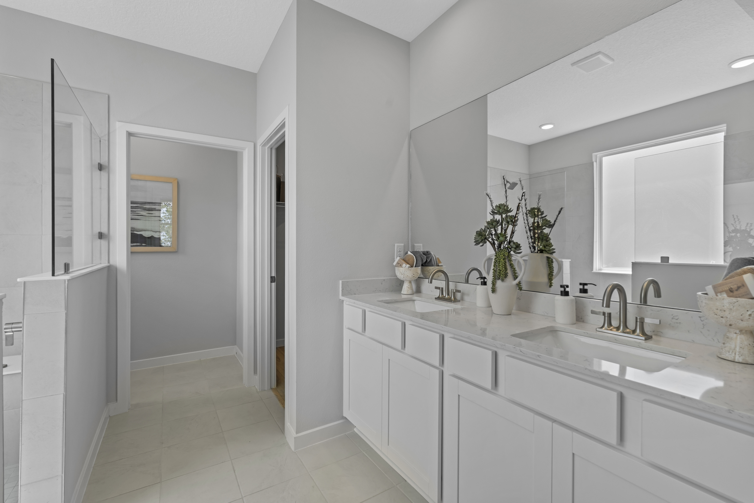 Coronado Model Home Primary Bathroom with Super Shower at Reserve East in Flagler Beach