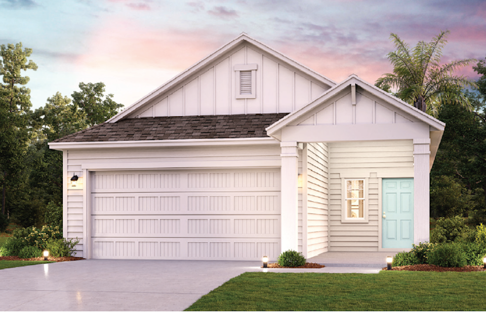 A white house with a garage.