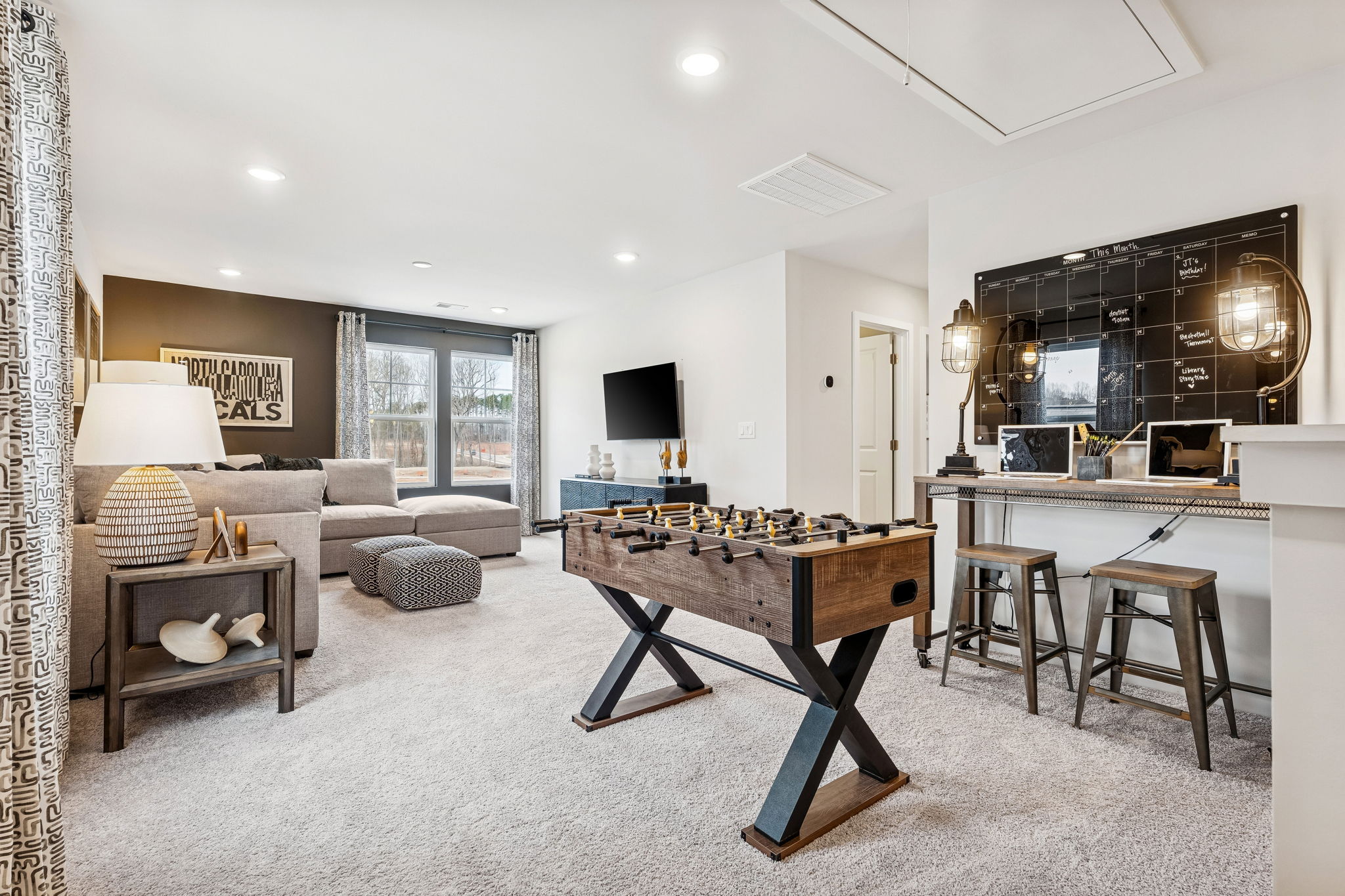 A living room with a bar and couches.