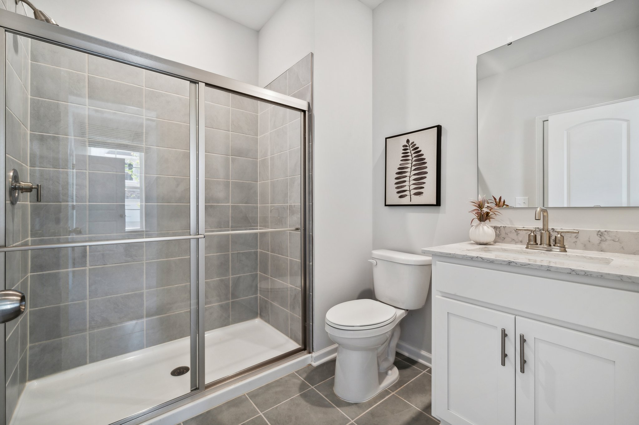 A bathroom with a glass shower.