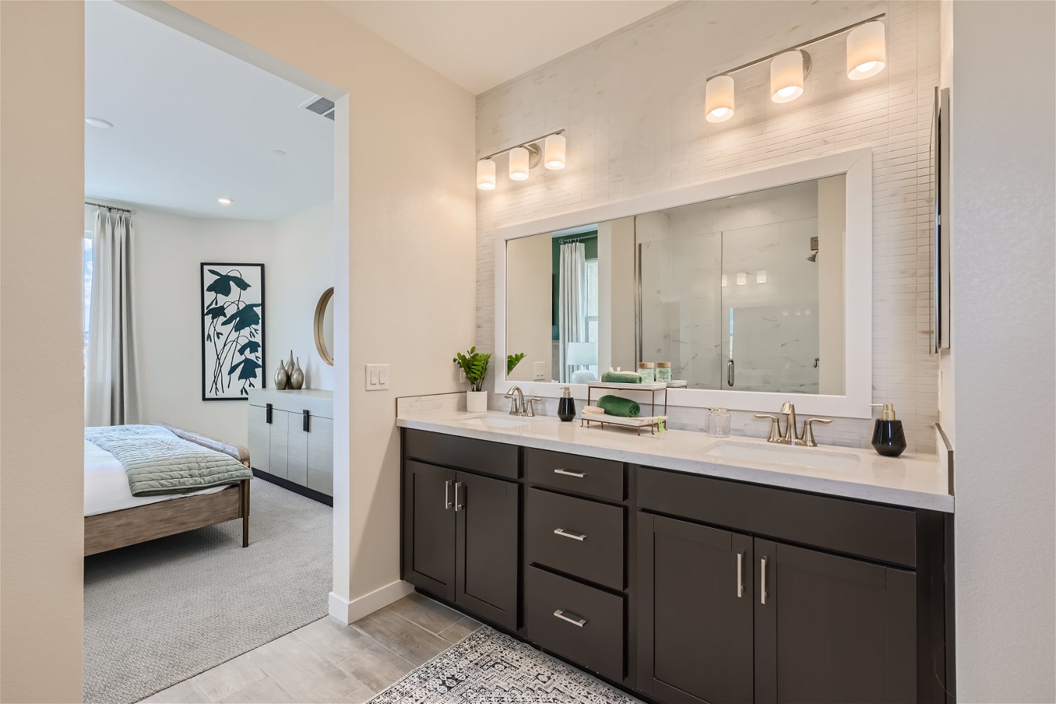 A bathroom with a large mirror.
