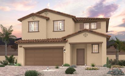A house with a garage and palm trees.
