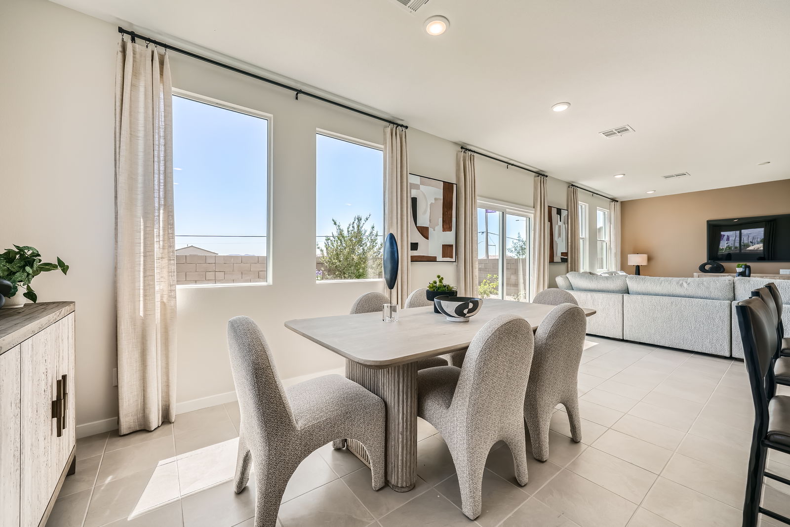 A large room with a table and chairs.