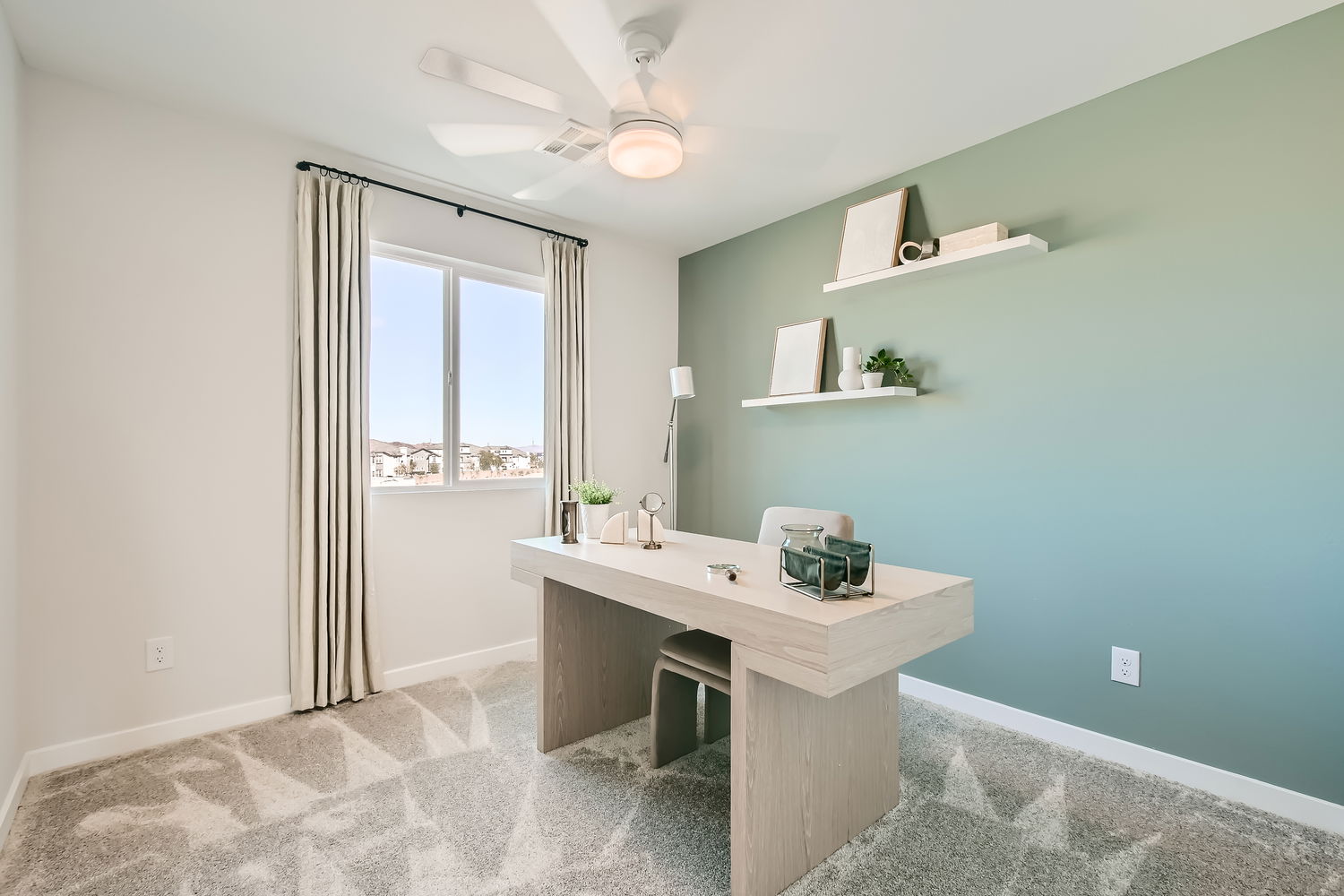 A bathroom with a counter and a window.