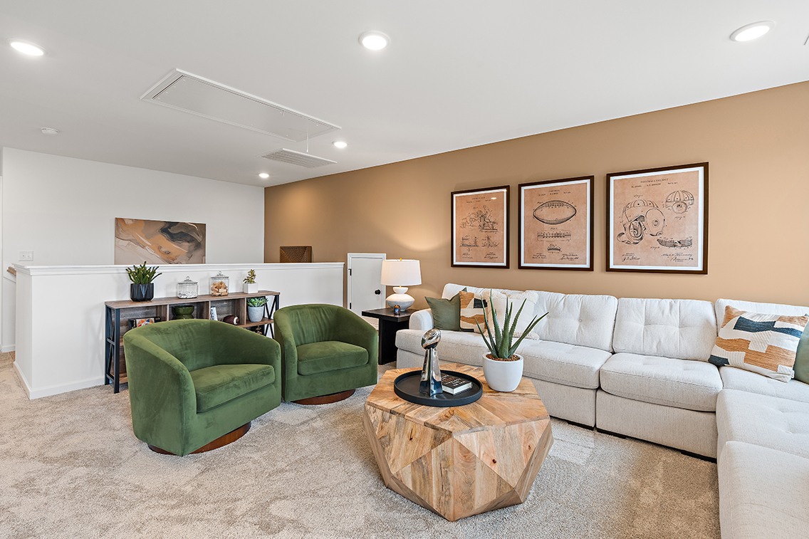 A living room with green couches.