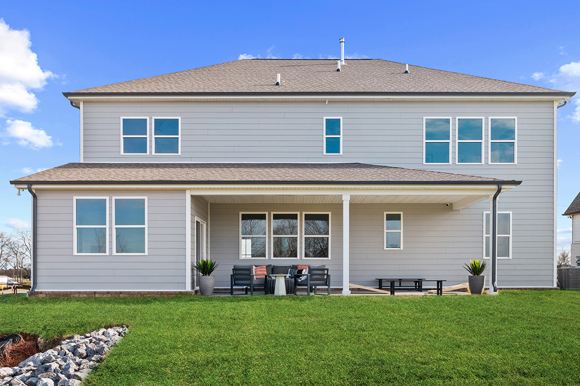 A house with a lawn in front.