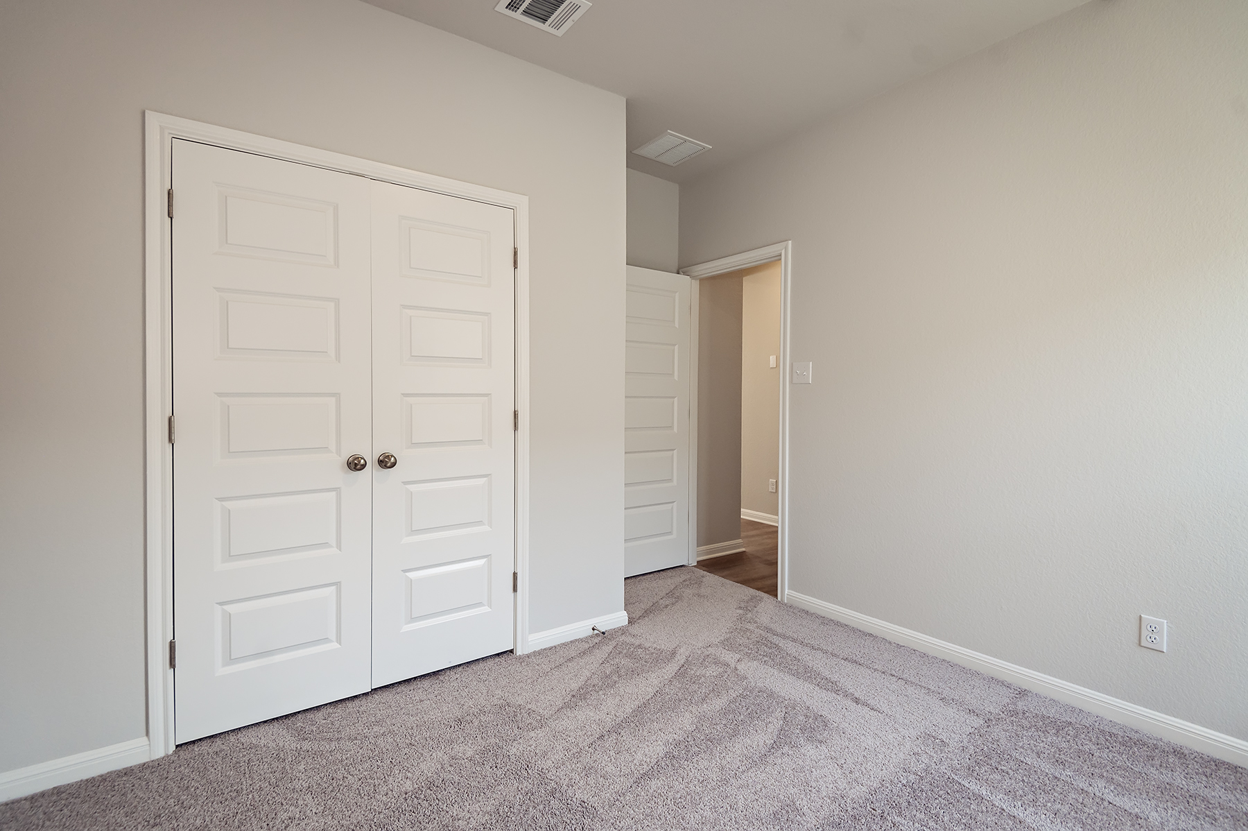 A room with white doors.