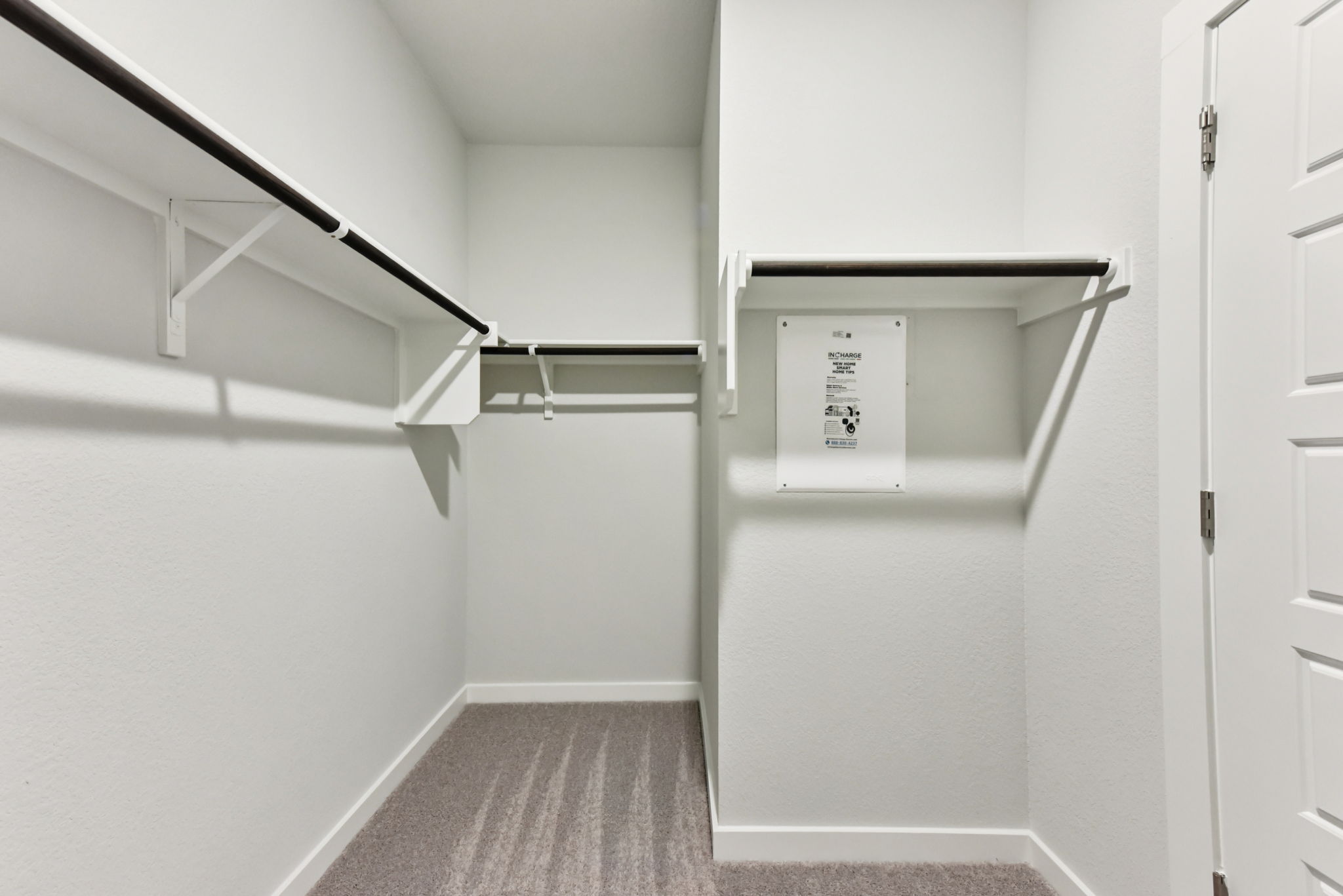A white refrigerator in a room.
