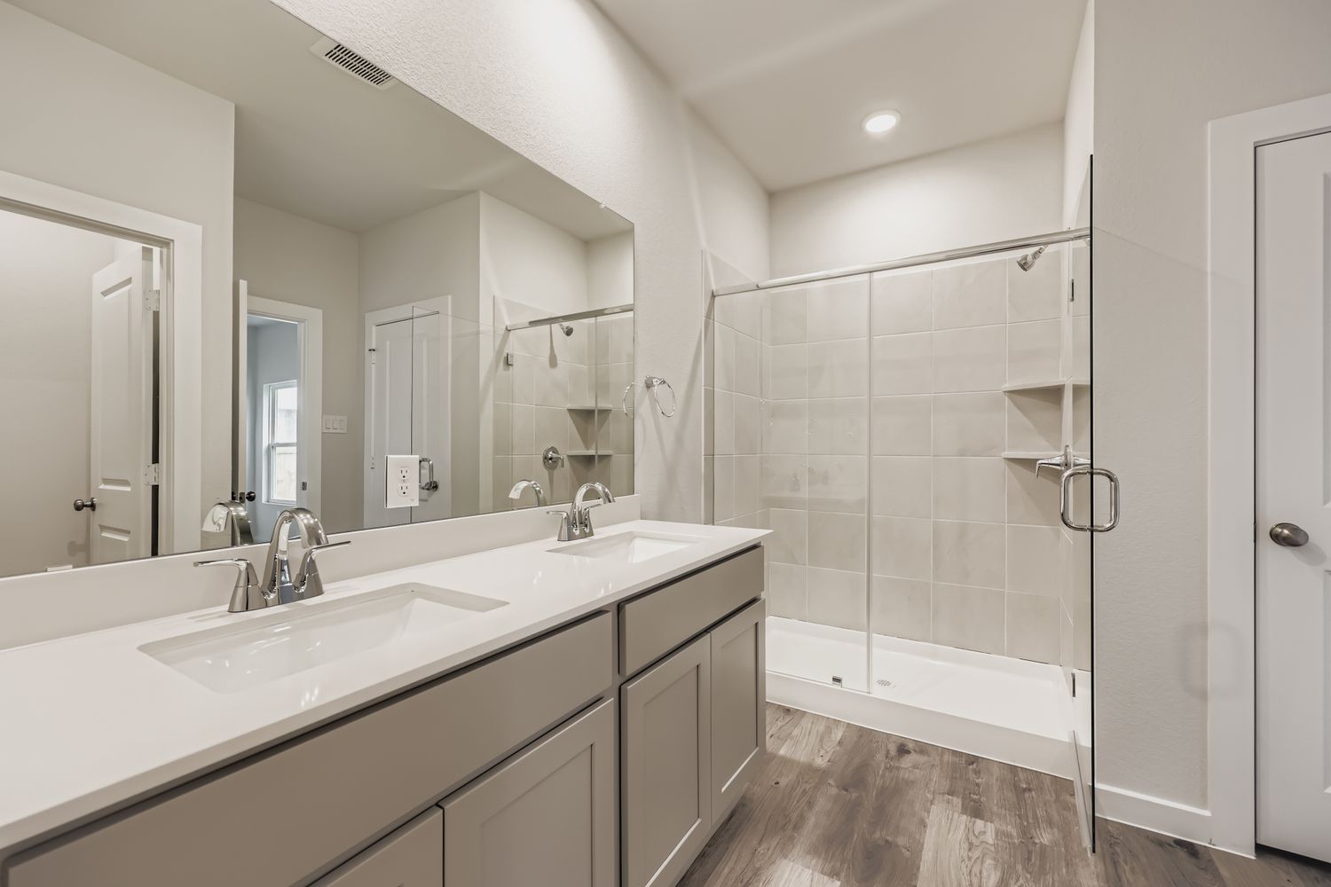 A bathroom with a glass shower.