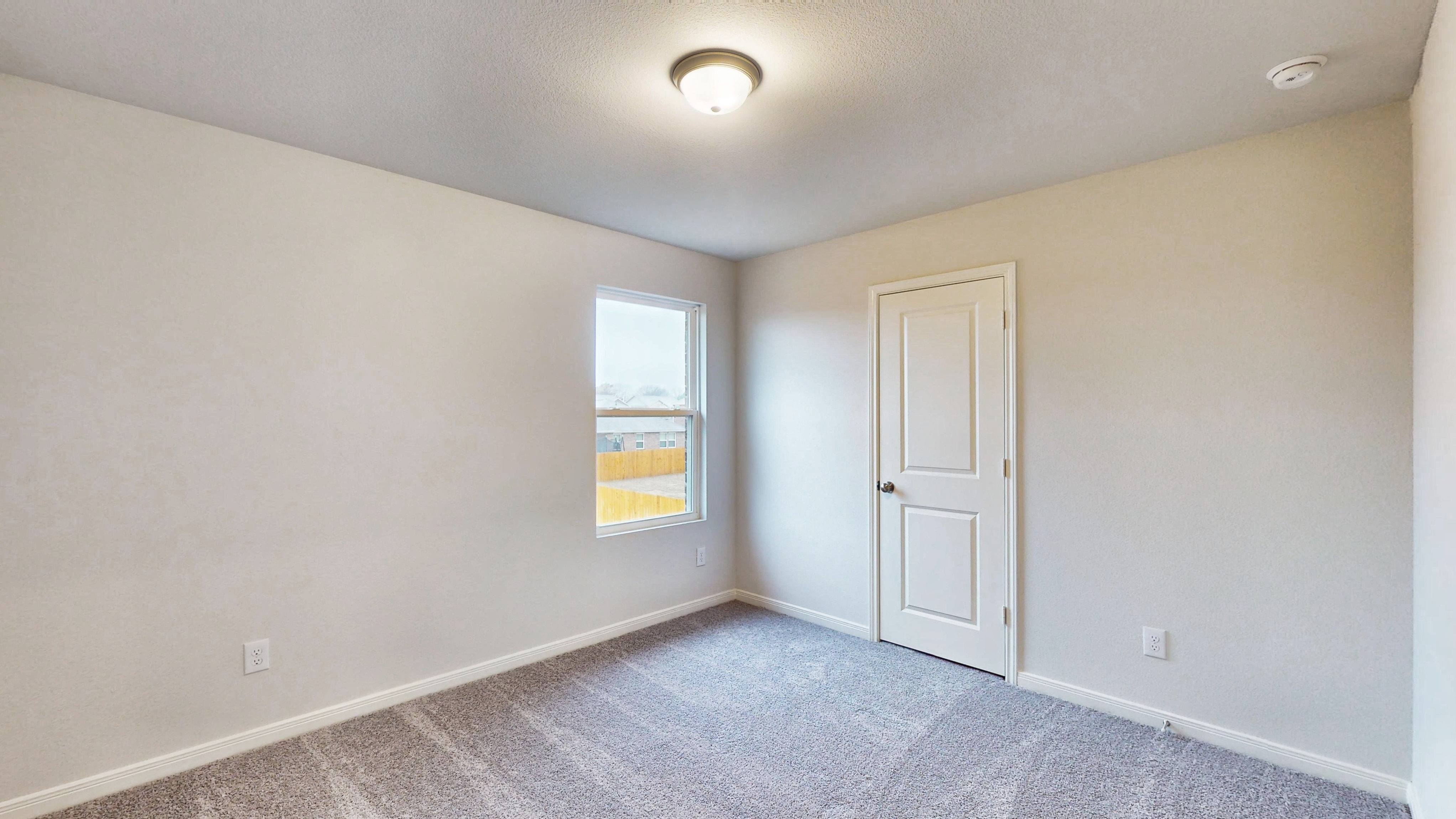 A room with a door and a window.