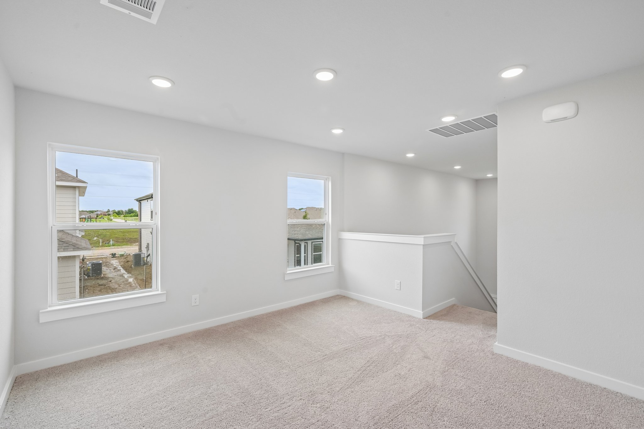 A room with a window and a door.