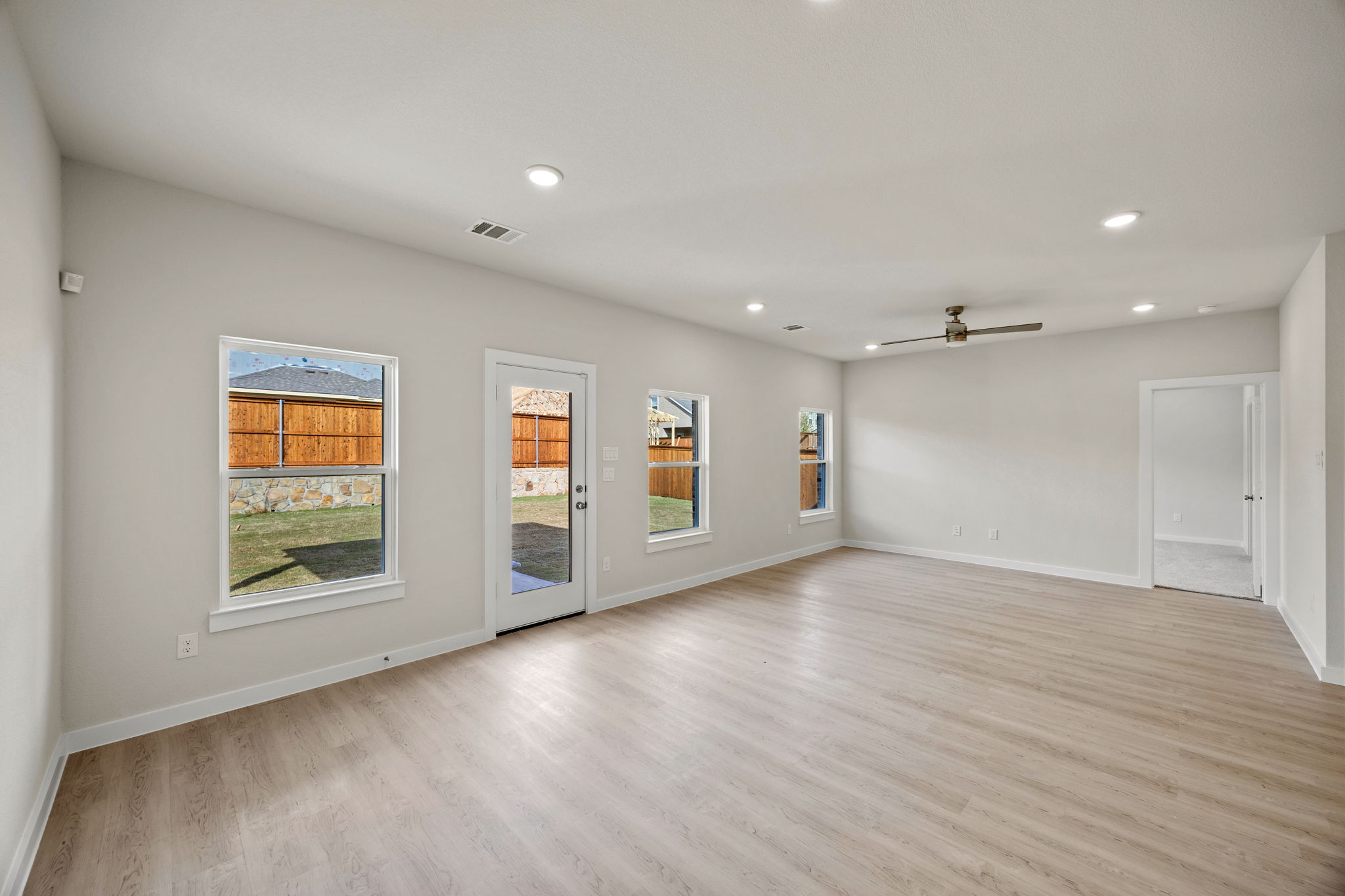 A room with a wood floor and a wood floor.