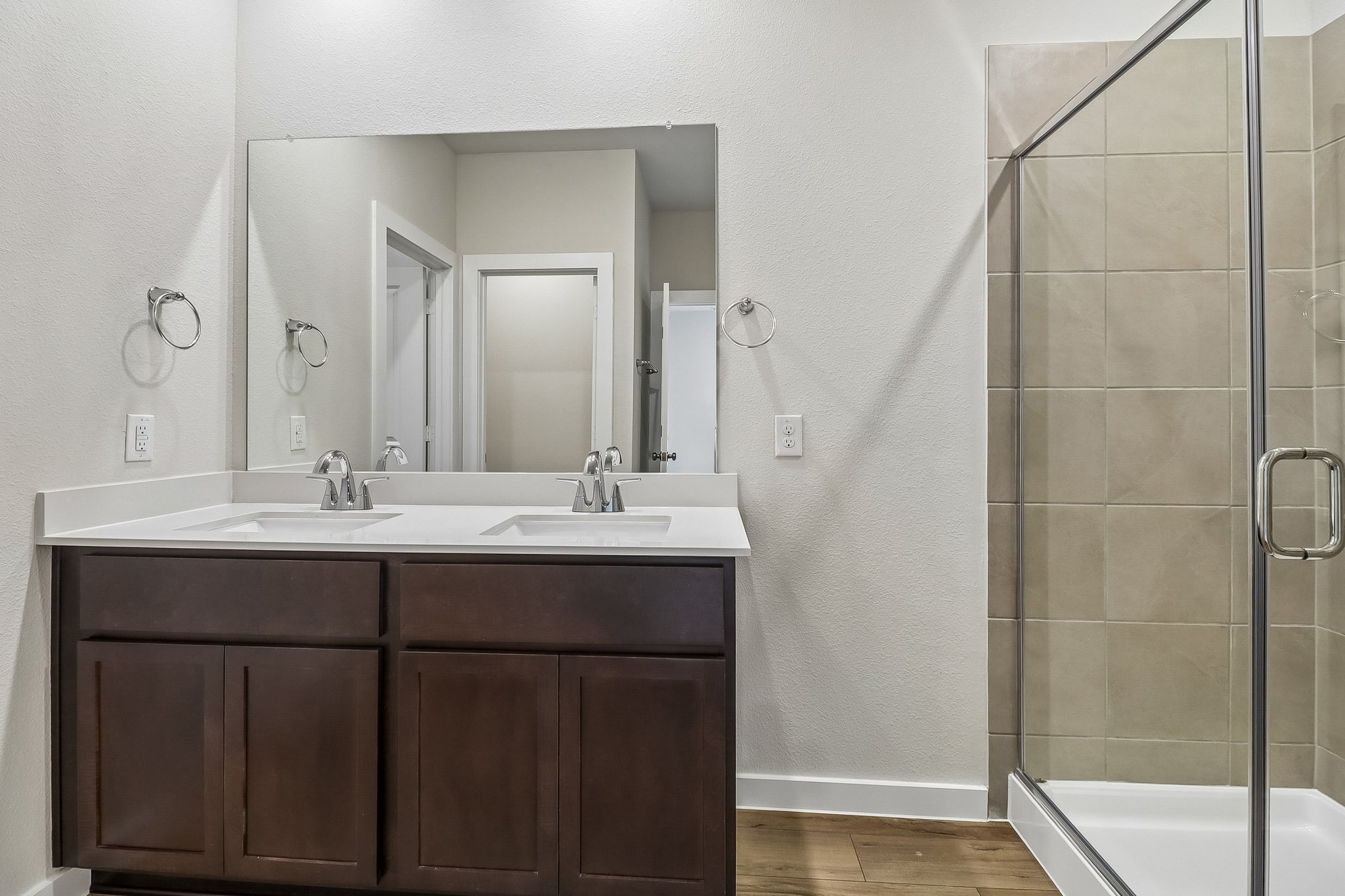A bathroom with a glass shower.