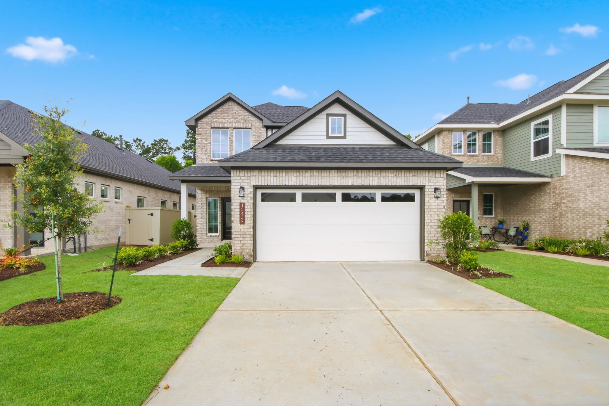 A driveway leading to a house.
