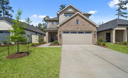 A driveway leading to a house.