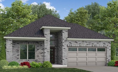 A house with a garage and trees in the back.