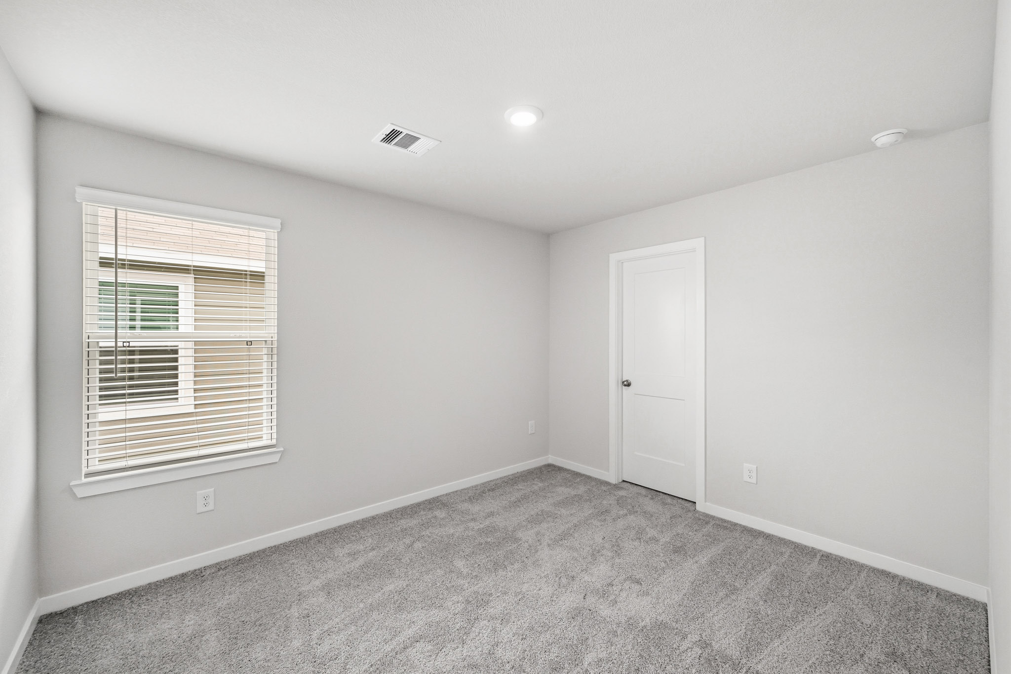A room with a door and a window.